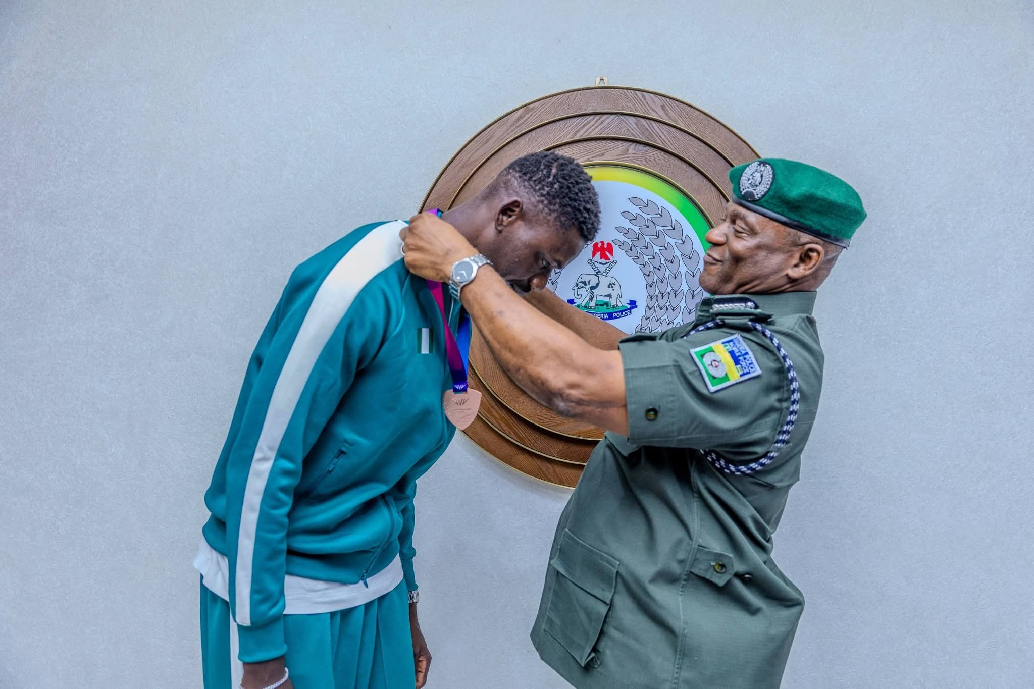 IGP Olatunji Disu receives Commonwealth Games Champion Nathaniel